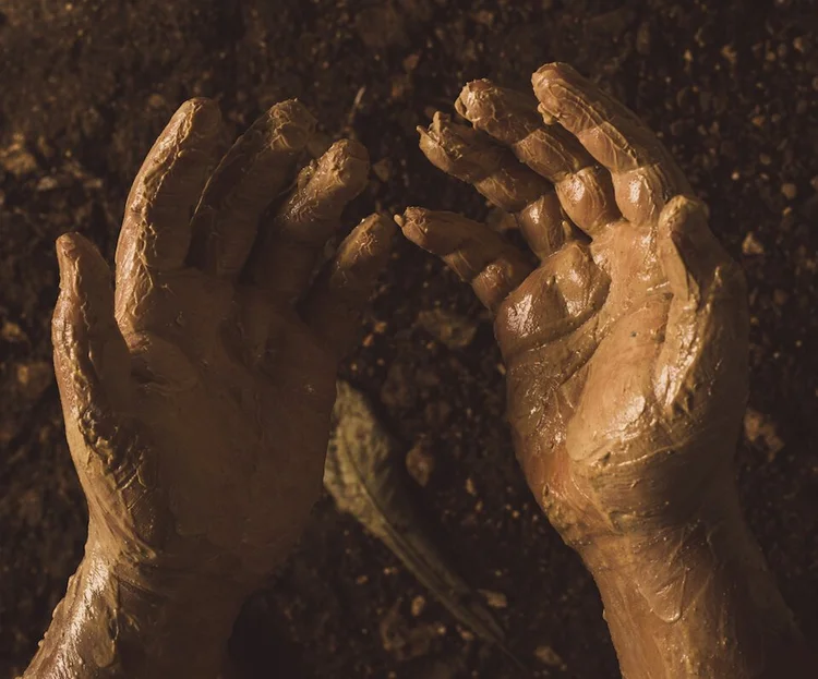 Guest shaping wet clay with both hands during a pottery session near Valladolid