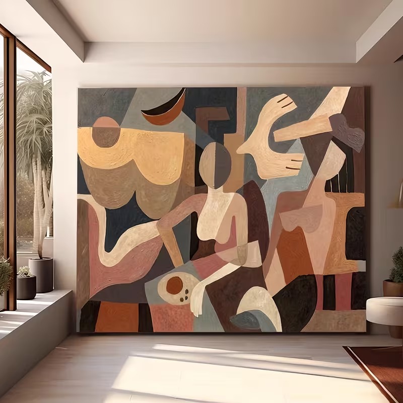 Large abstract figurative painting in earthy beige, terracotta and charcoal tones mounted on a gallery wall in a bright Tulum interior.
